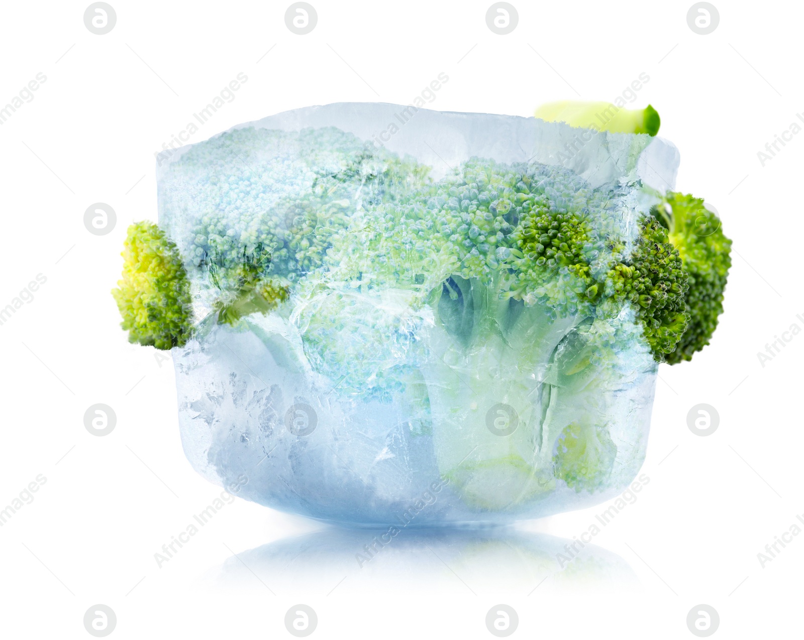 Image of Frozen food. Raw broccoli in ice cube isolated on white