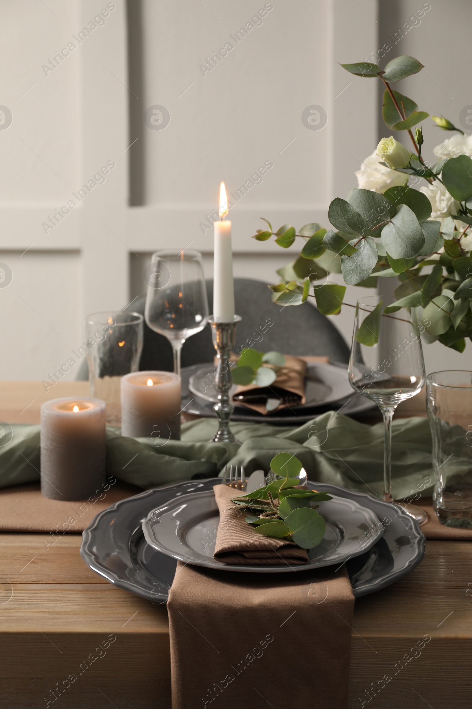 Photo of Festive table setting with beautiful floral decor indoors