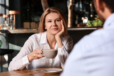 Photo of Romantic date. Happy couple spending time together in cafe