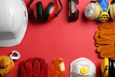 Photo of Flat lay composition with safety equipment and space for text on color background