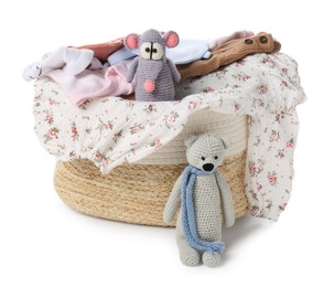 Photo of Laundry basket with baby clothes and soft toys isolated on white