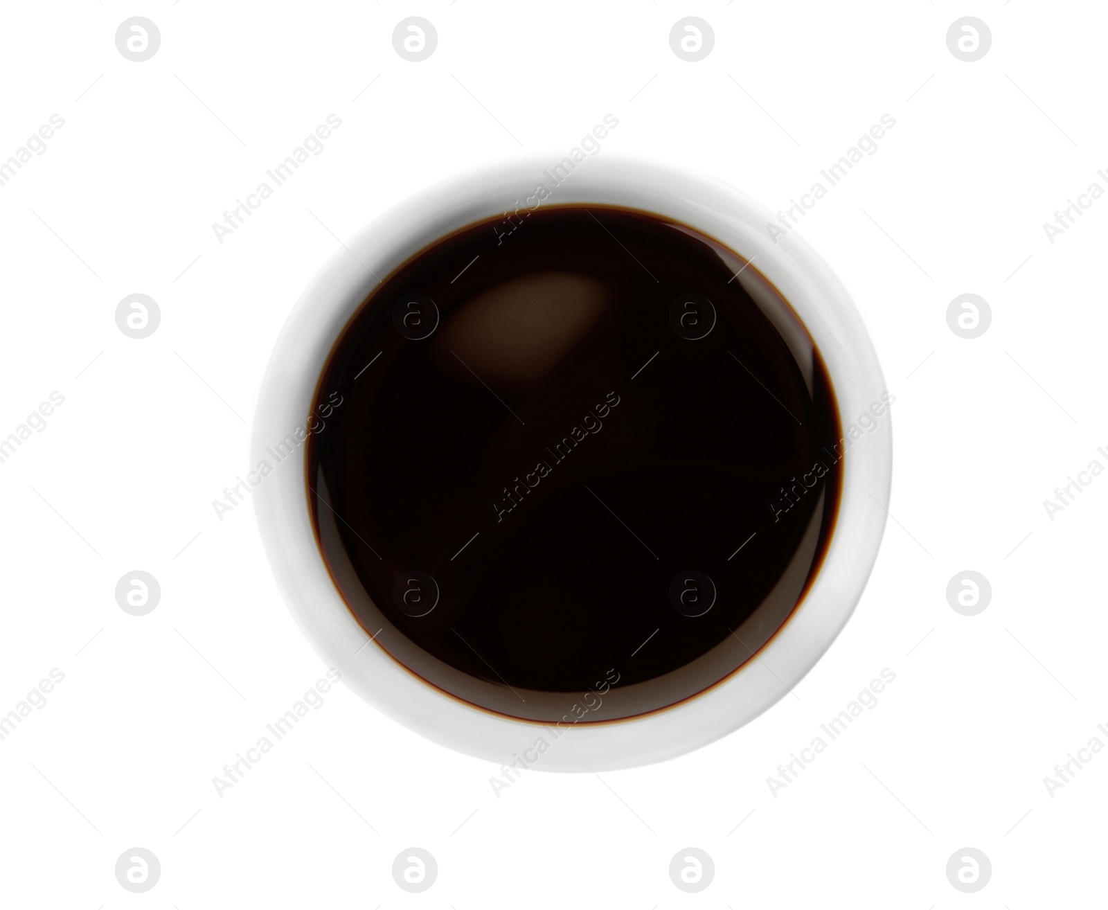 Photo of Bowl of tasty soy sauce isolated on white, top view