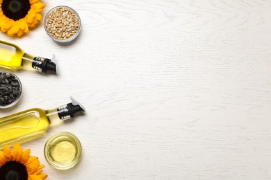 Photo of Flat lay composition with sunflower cooking oil on white wooden table. Space for text