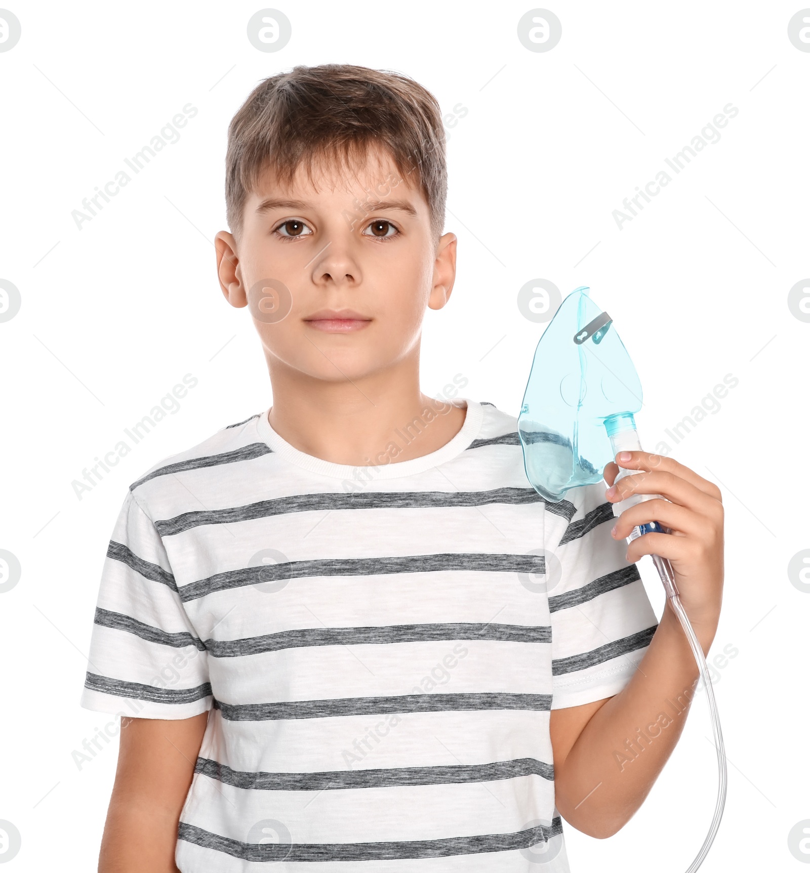 Photo of Boy holding nebulizer for inhalation on white background