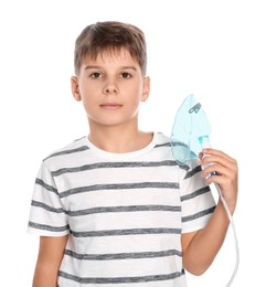 Boy holding nebulizer for inhalation on white background