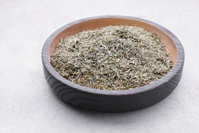 Photo of Plate with dried thyme on grey table, closeup