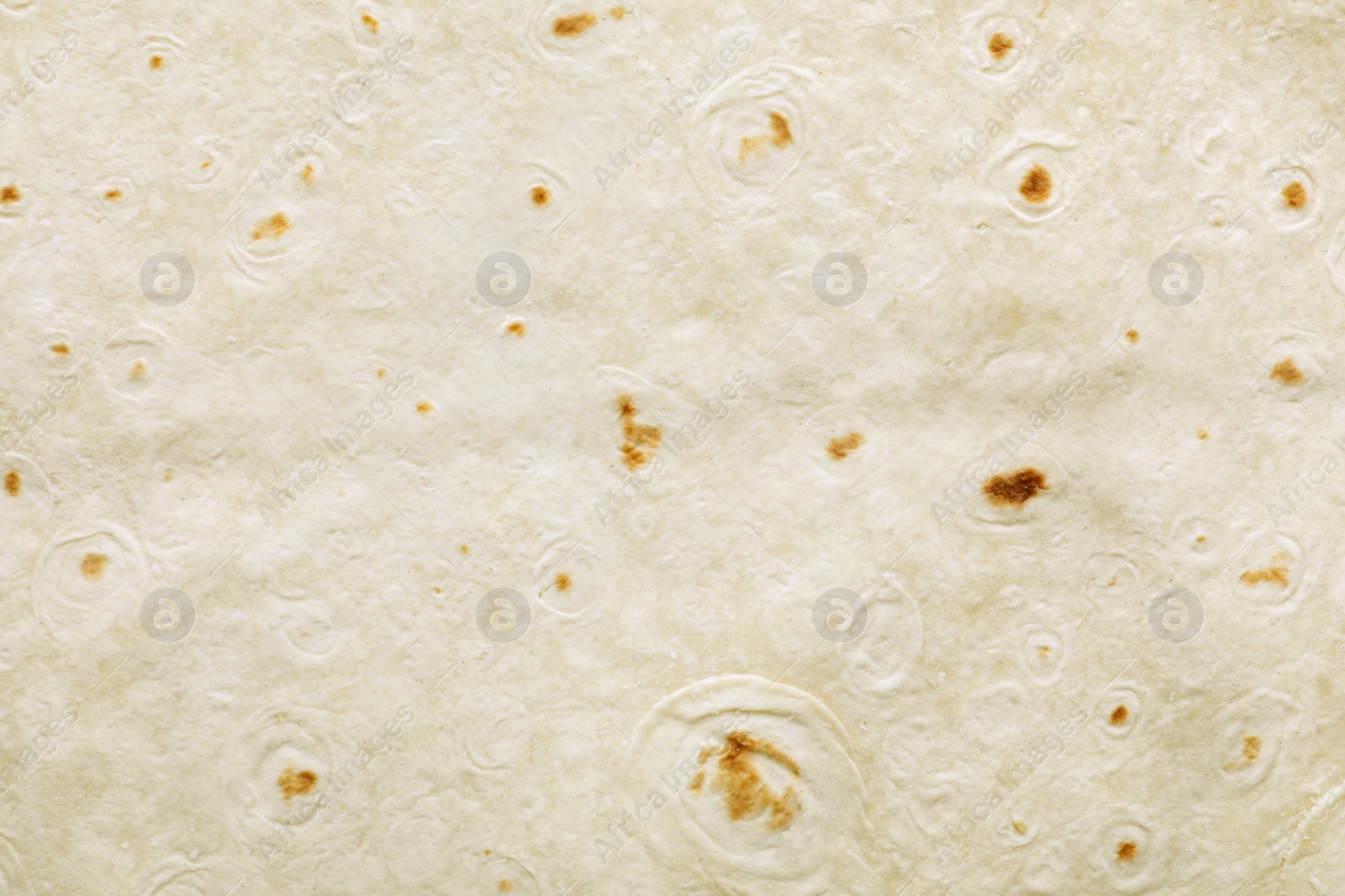 Photo of Texture of thin Armenian lavash as background, top view