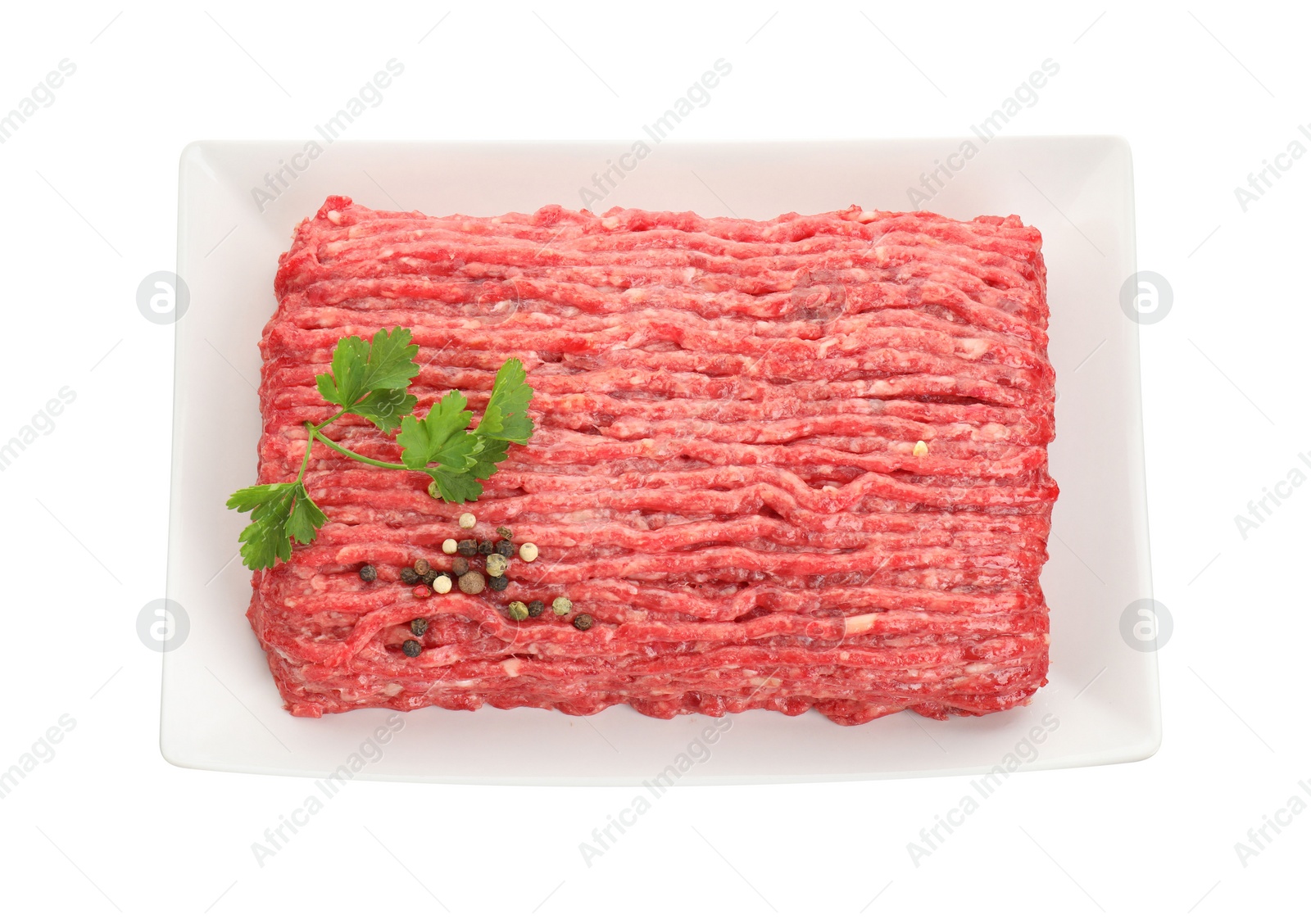 Photo of Raw ground meat, parsley and peppercorns isolated on white, top view