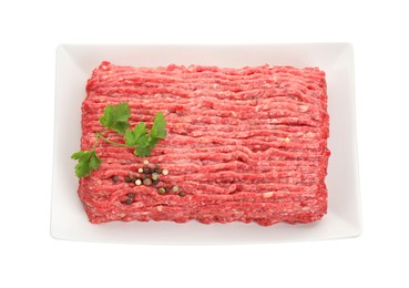 Photo of Raw ground meat, parsley and peppercorns isolated on white, top view