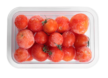 Photo of Frozen tomatoes in plastic container isolated on white, top view. Vegetable preservation