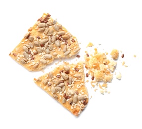 Photo of Broken delicious crispy cracker with seeds on white background, top view