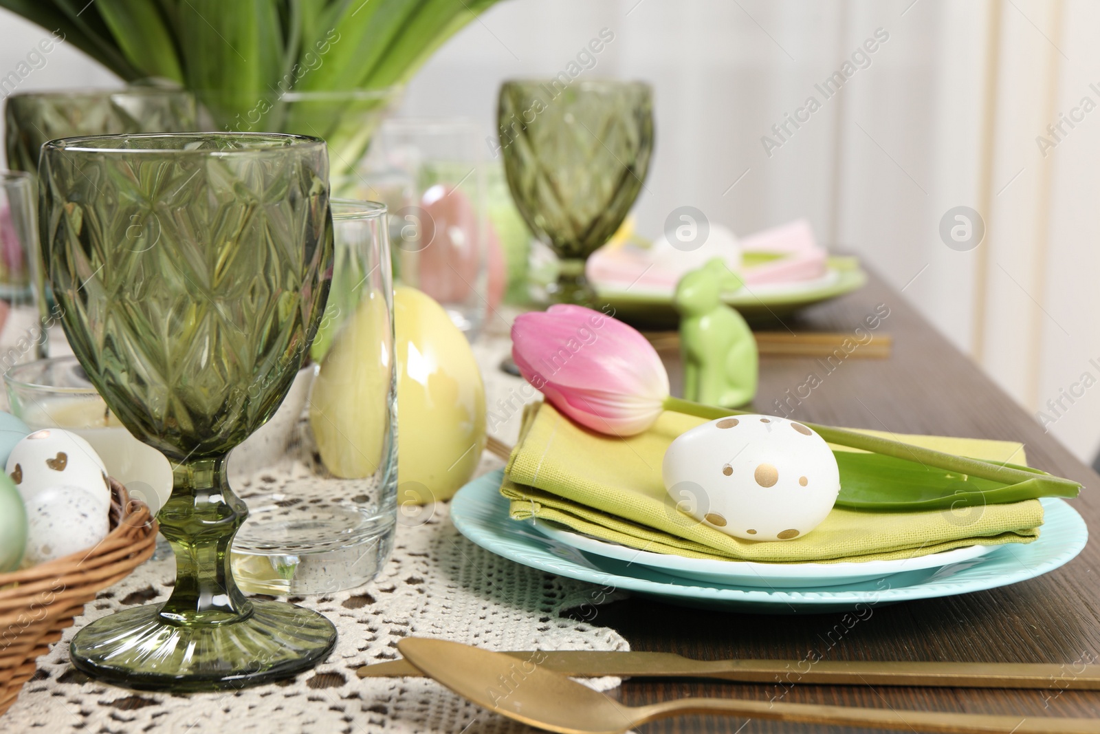 Photo of Festive table setting with beautiful tulip. Easter celebration