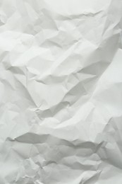 Photo of Crumpled notebook sheet as background, top view