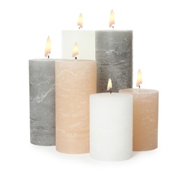 Photo of Many alight wax candles on white background