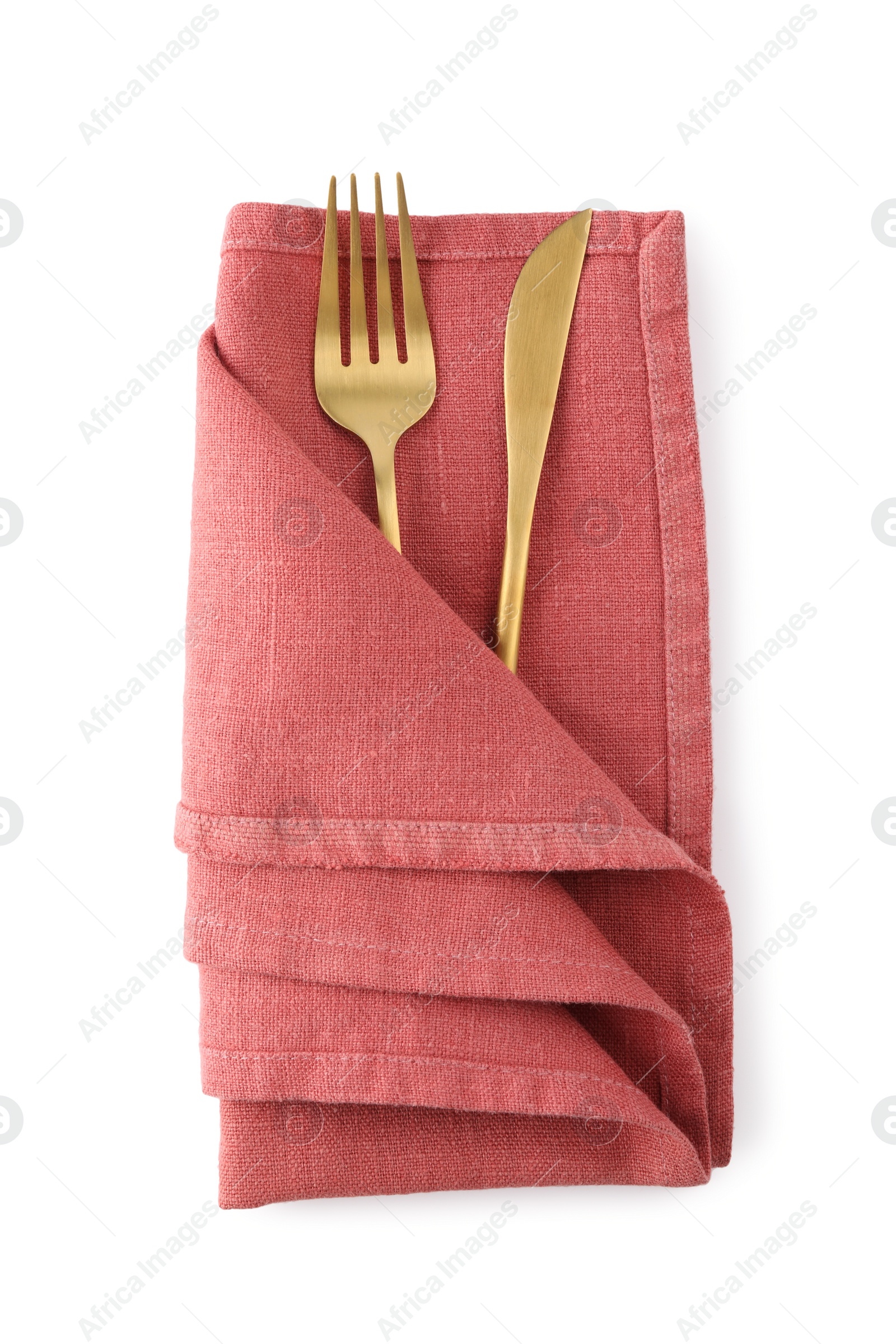 Photo of Red napkin with golden fork and knife isolated on white, top view. Cutlery set