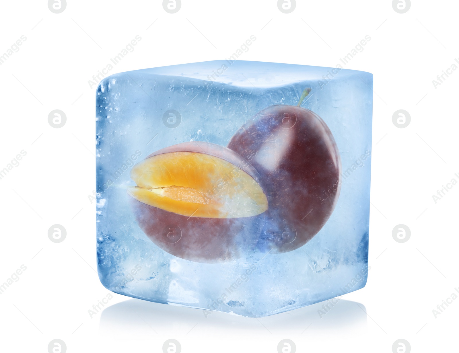 Image of Frozen food. Raw plums in ice cube isolated on white