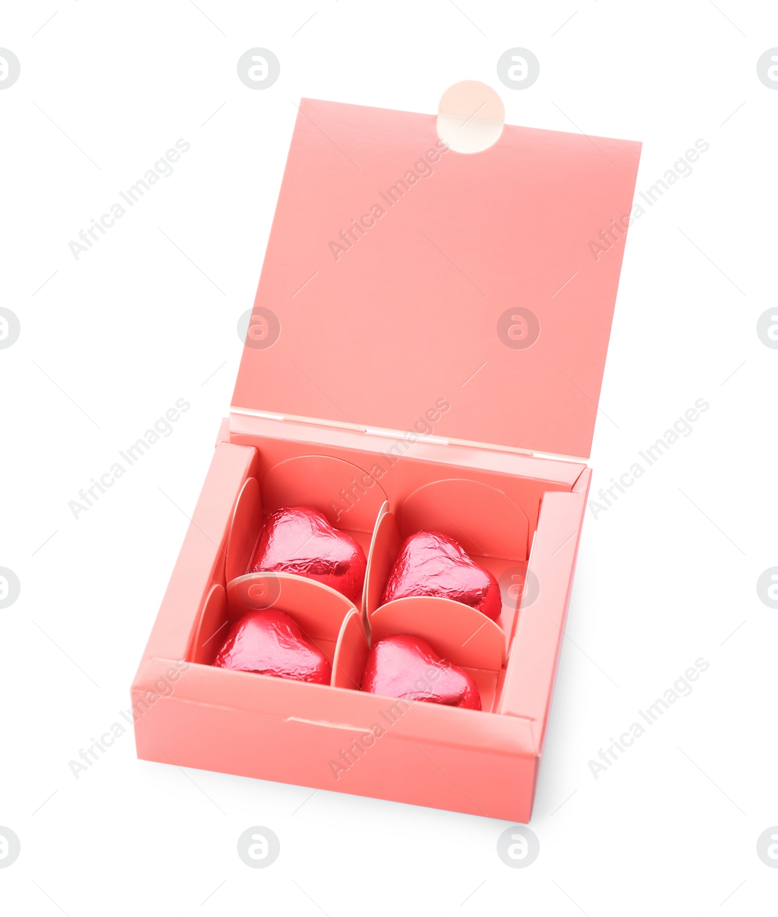 Photo of Heart shaped chocolate candies in box on white background