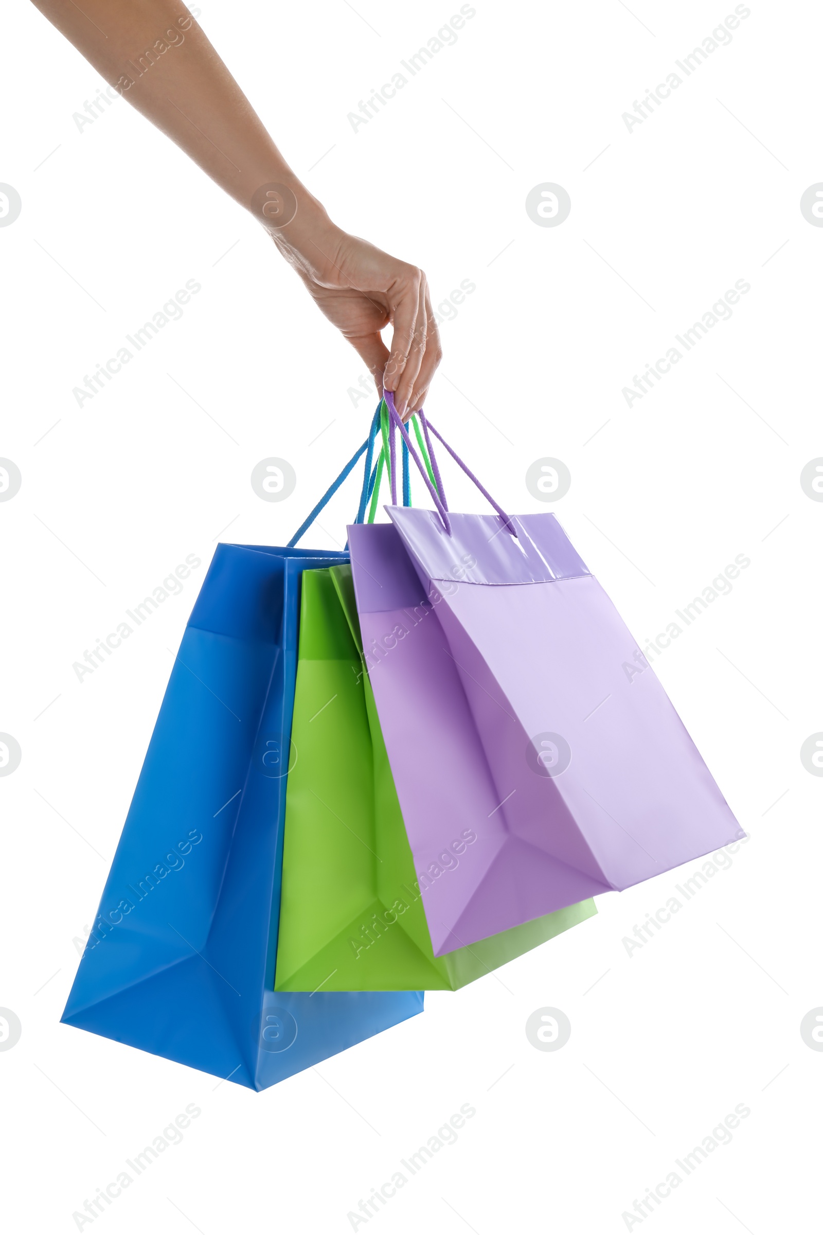 Photo of Woman with paper shopping bags on white background, closeup