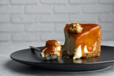 Photo of Piece of delicious cake with caramel and popcorn on plate, closeup. Space for text