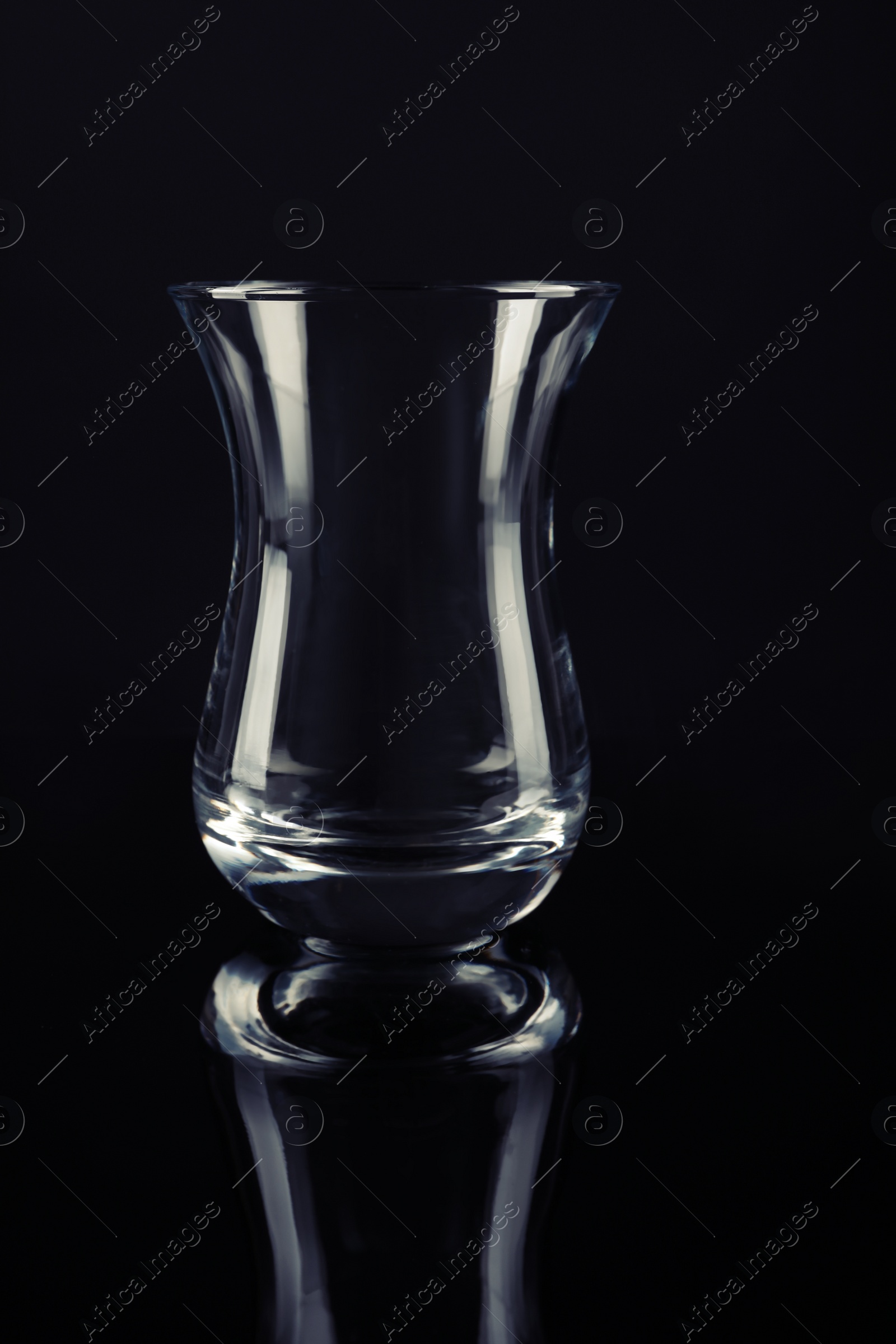 Photo of Clean empty transparent glass on black background