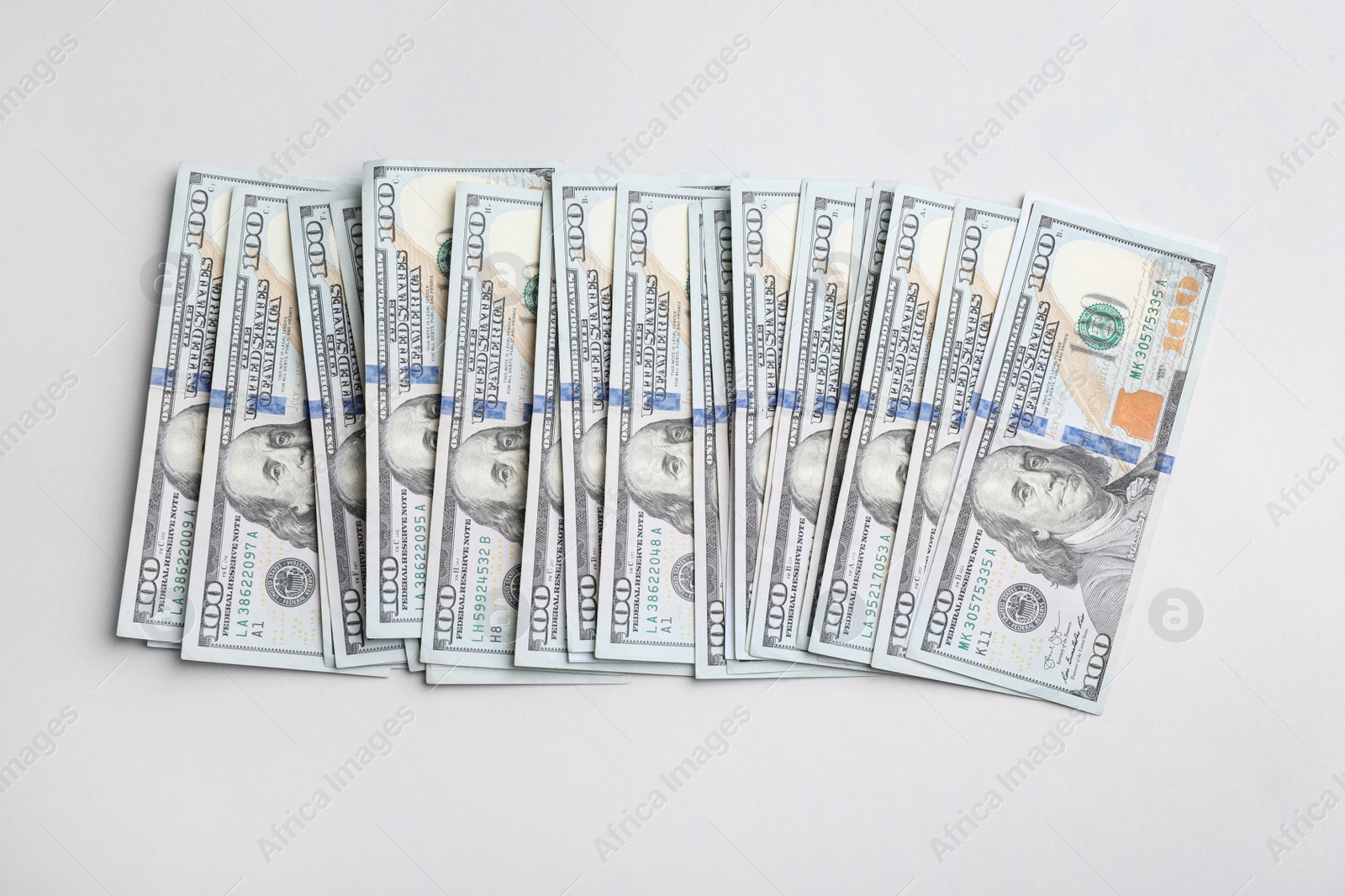 Photo of Dollar banknotes on light grey background, top view. American national currency