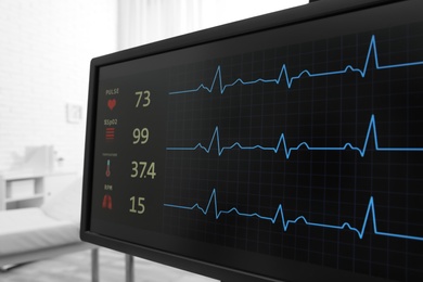 Black monitor with cardiogram in hospital, closeup