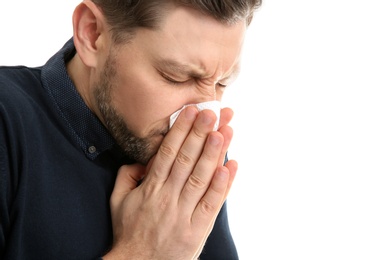 Man suffering from cold isolated on white