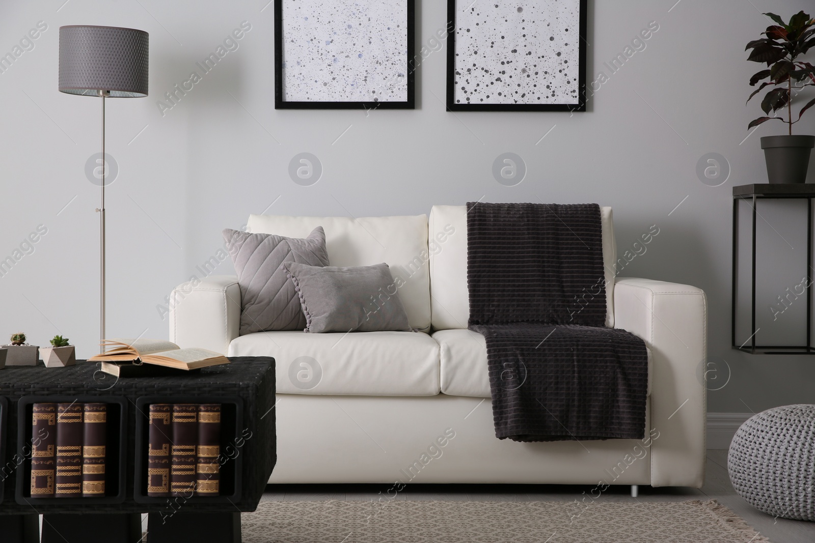 Photo of Modern comfortable sofa in stylish living room interior