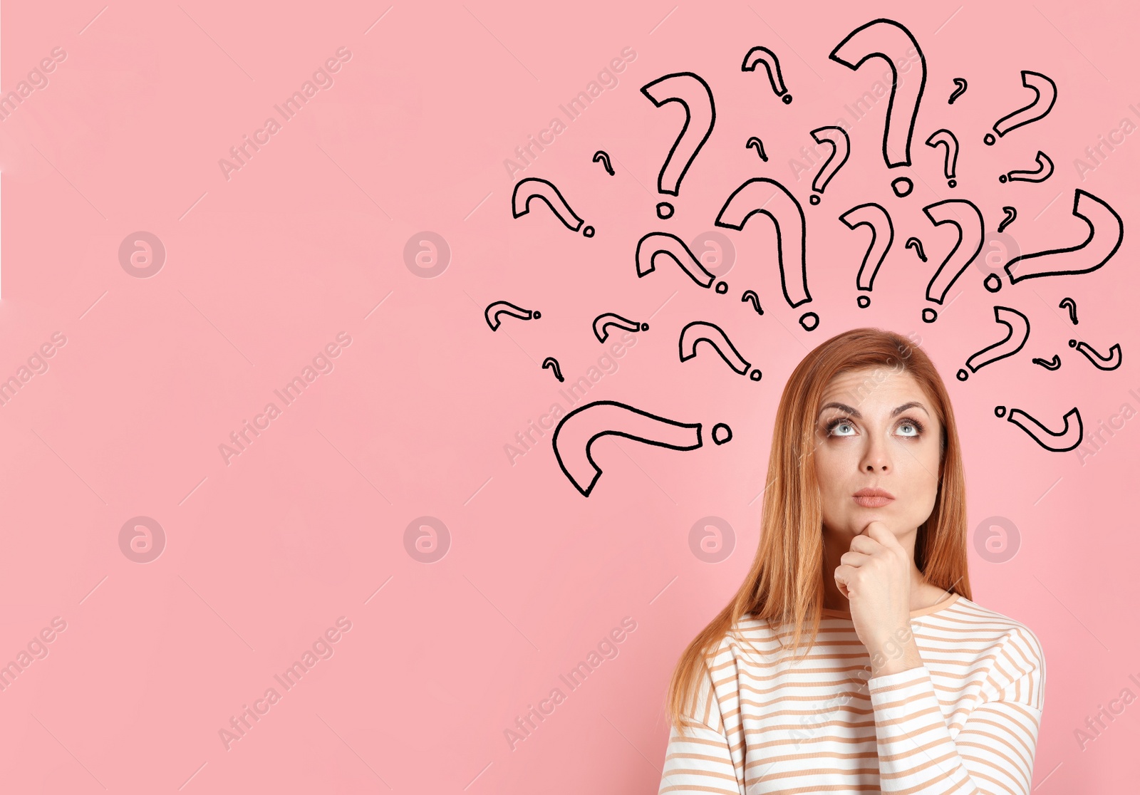 Image of Emotional woman with drawings of question marks on pink background. Space for text