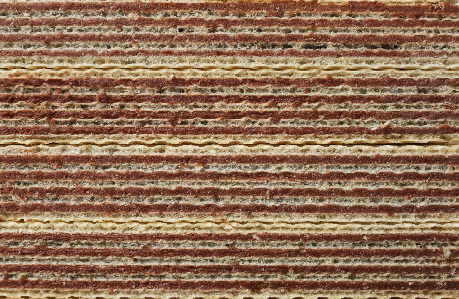 Photo of Closeup view of tasty wafer sticks as background. Sweet food