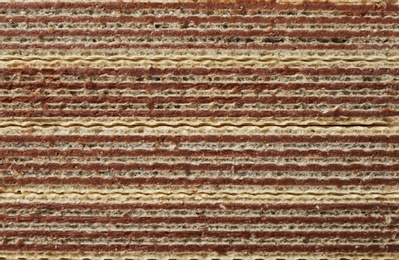 Photo of Closeup view of tasty wafer sticks as background. Sweet food