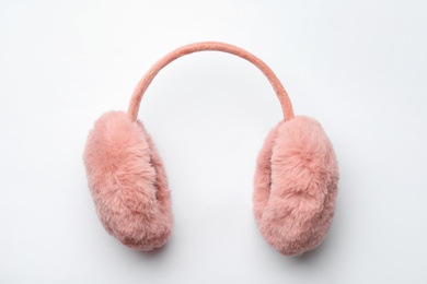 Stylish winter earmuffs on white background, top view