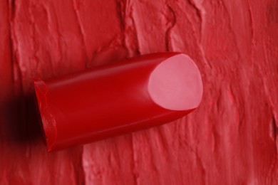Photo of Beautiful red lipstick and smears, closeup view