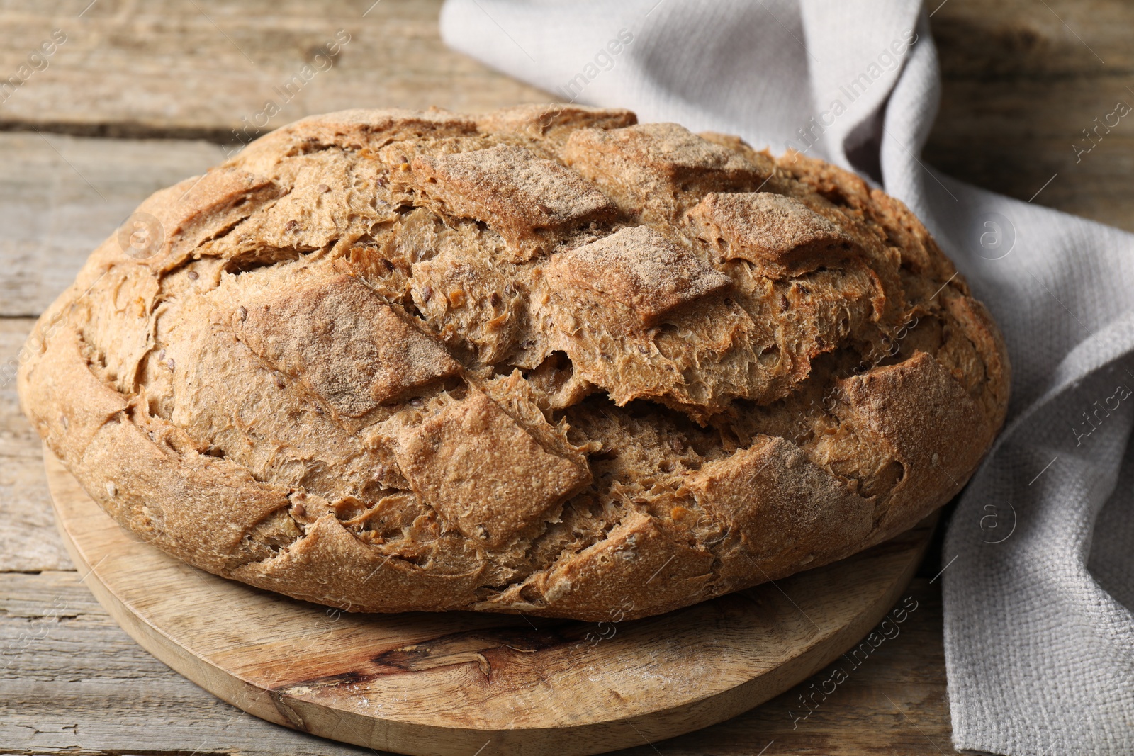 Photo of Freshly baked sourdough bread on wooden table