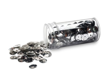 Photo of Many silver sequins and tube on white background