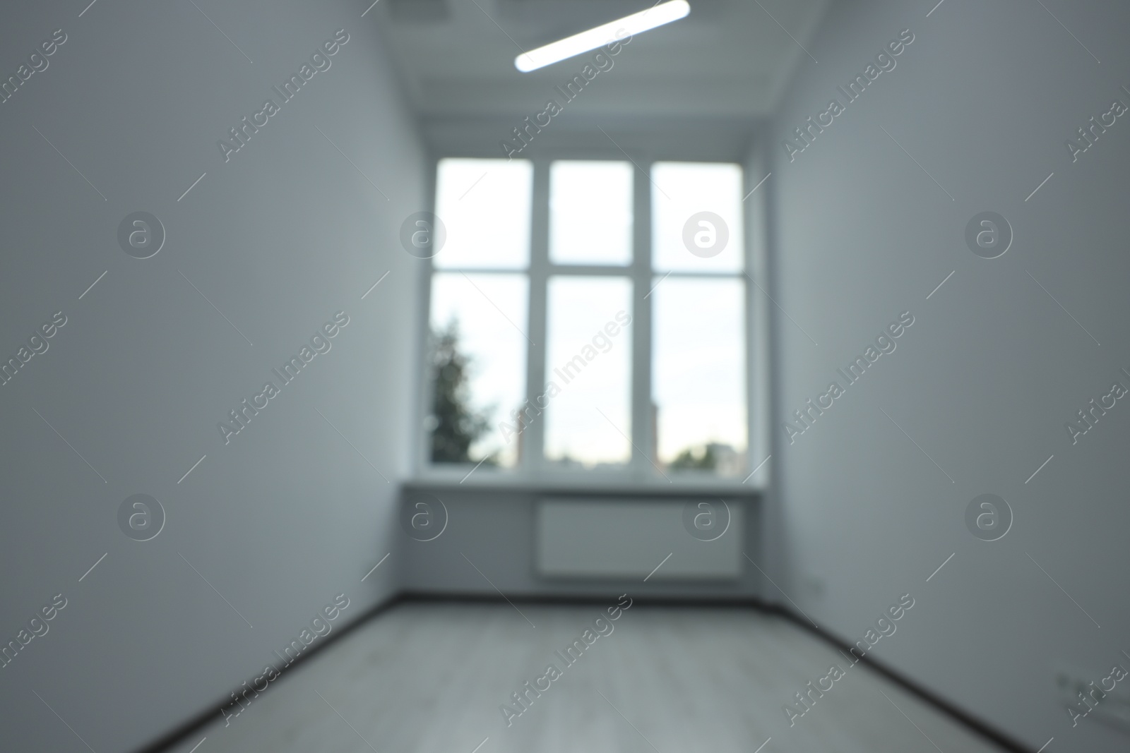 Photo of Blurred view of window in empty renovated room