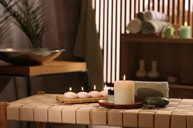 Beautiful composition with different spa products on wicker bench indoors