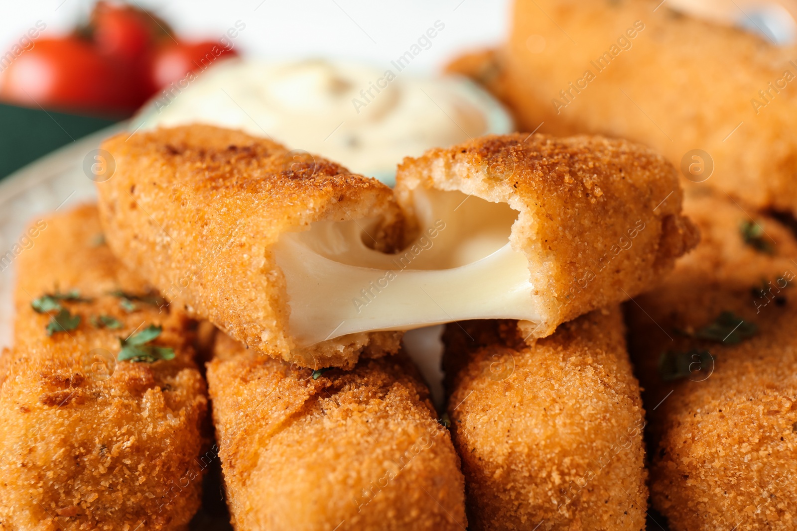 Photo of Pile of tasty crispy cheese sticks, closeup