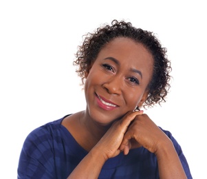 Portrait of happy African-American woman on white background