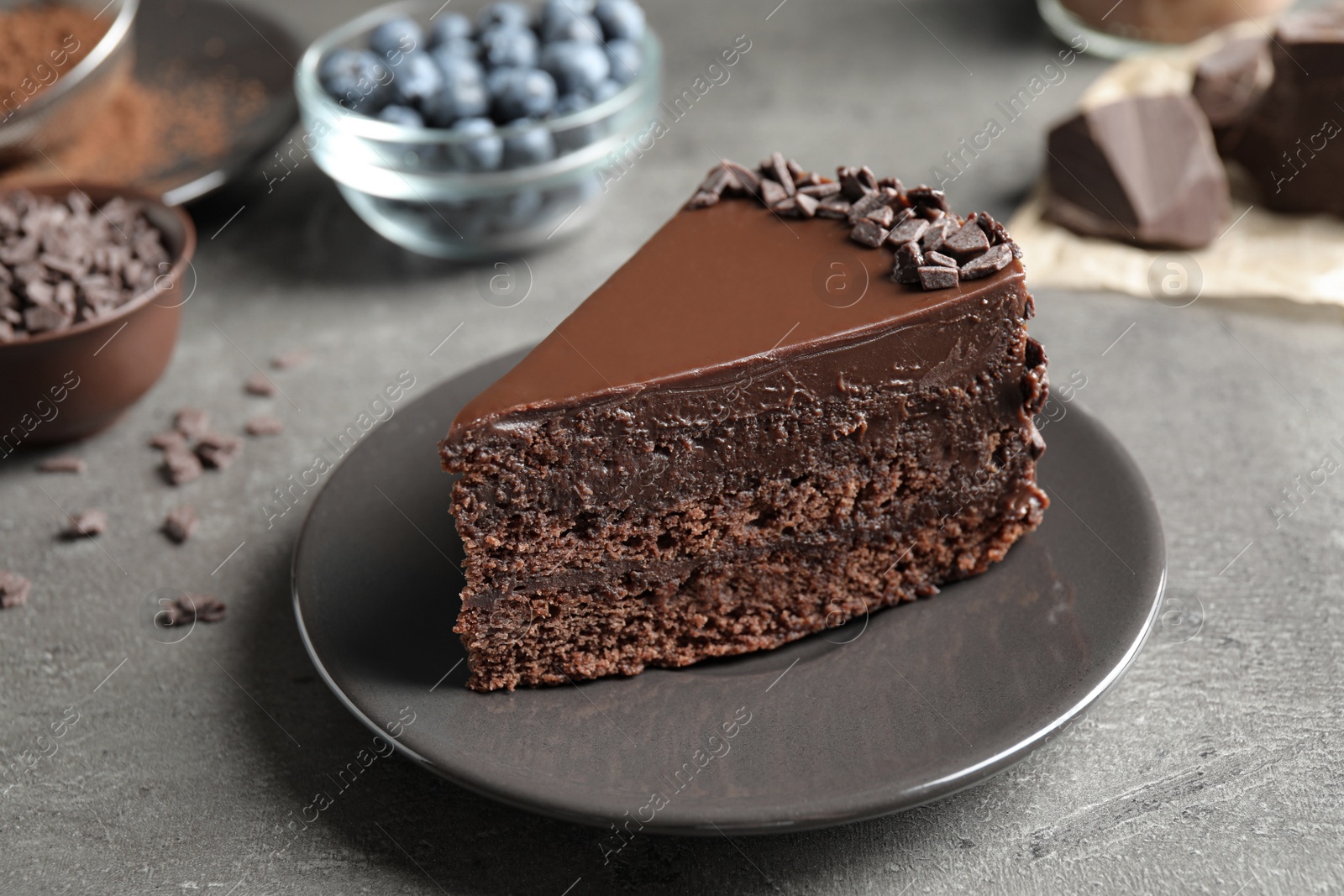 Photo of Delicious fresh chocolate cake served on grey table