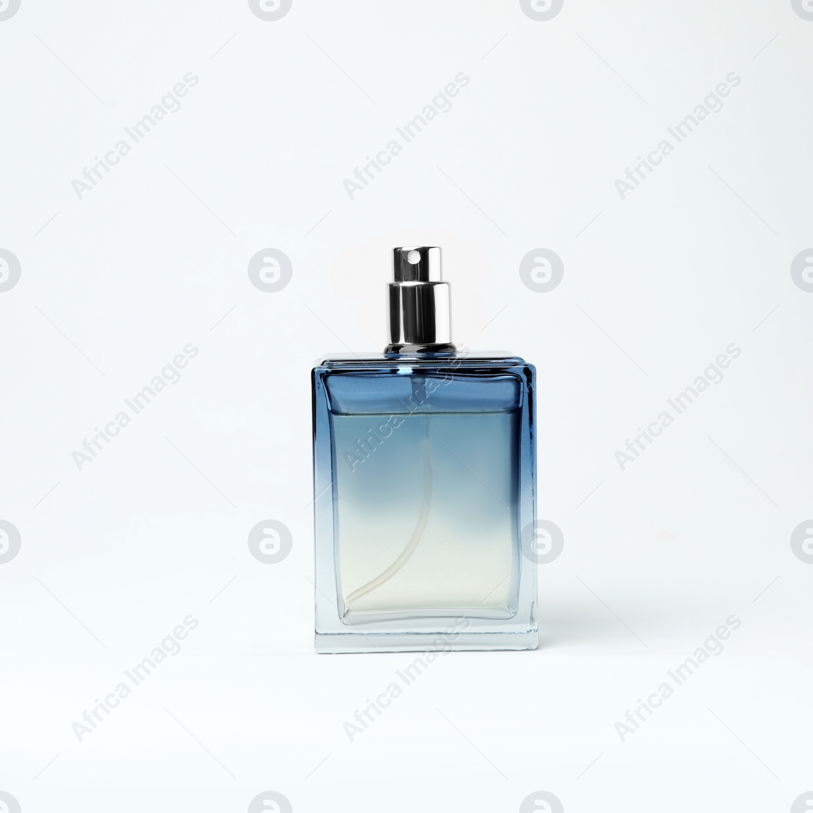 Photo of Transparent bottle of perfume on white background