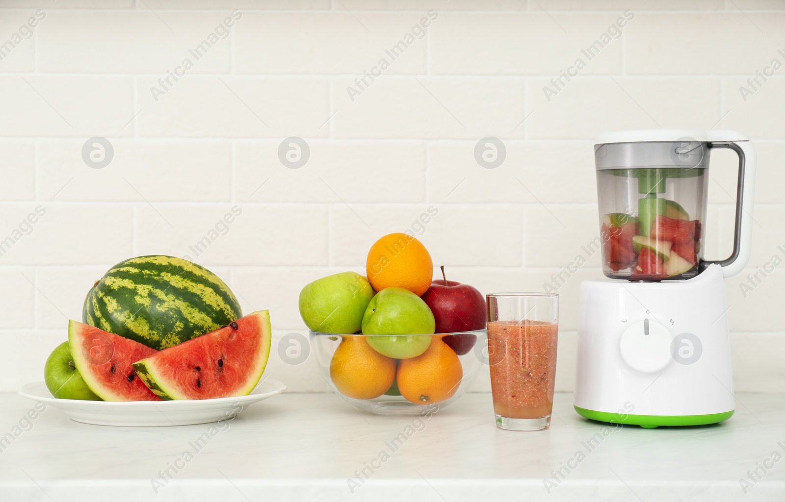 Photo of Blender and smoothie ingredients on counter in kitchen