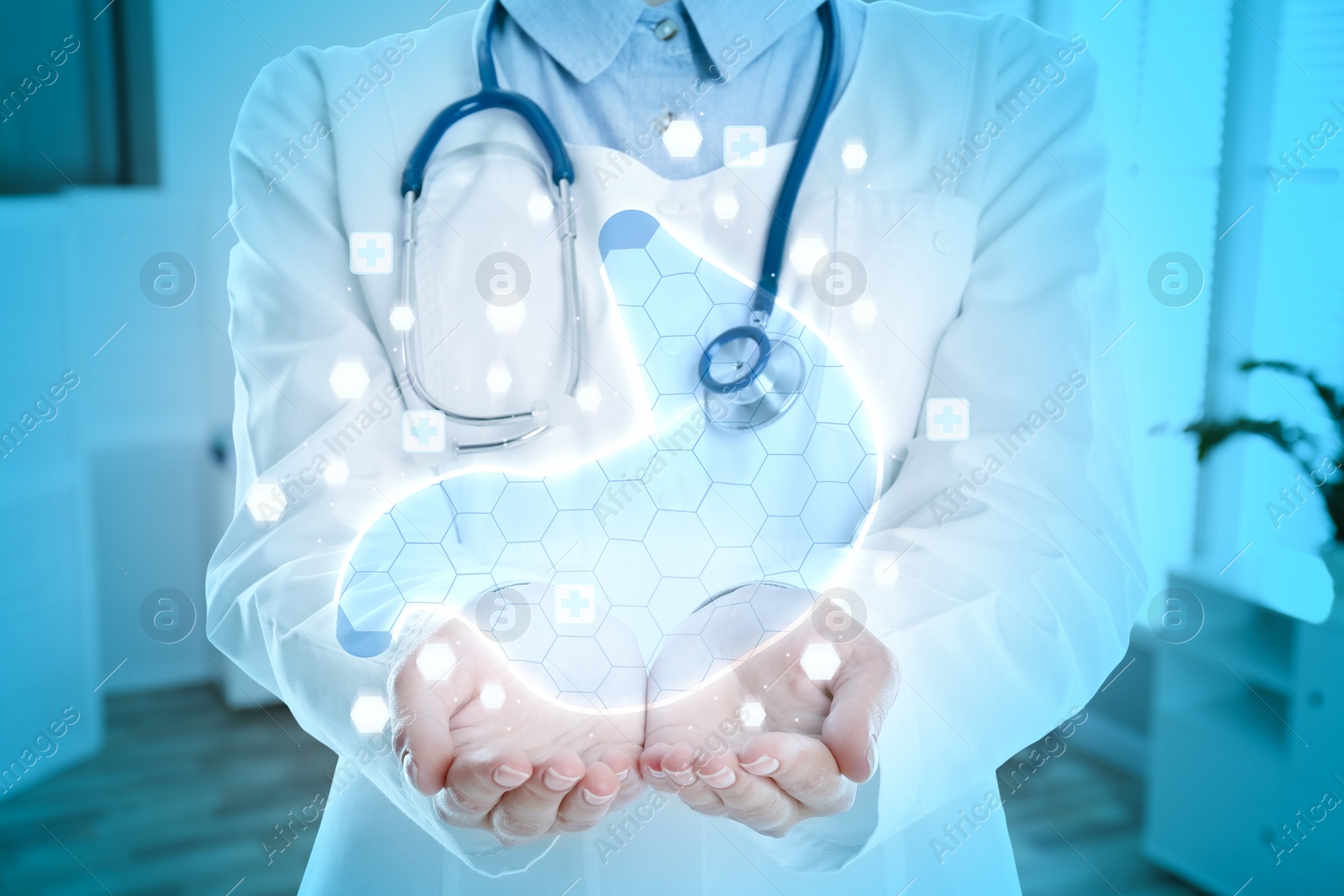 Image of Gastroenterologist holding virtual image of stomach indoors, closeup
