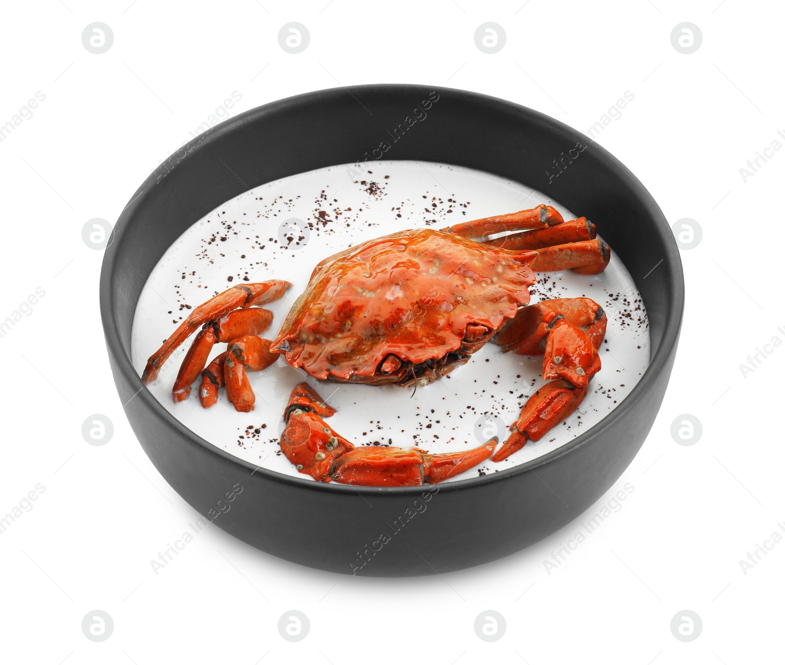 Photo of Delicious boiled crab with cream sauce in bowl isolated on white