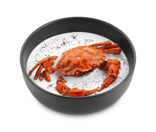 Photo of Delicious boiled crab with cream sauce in bowl isolated on white