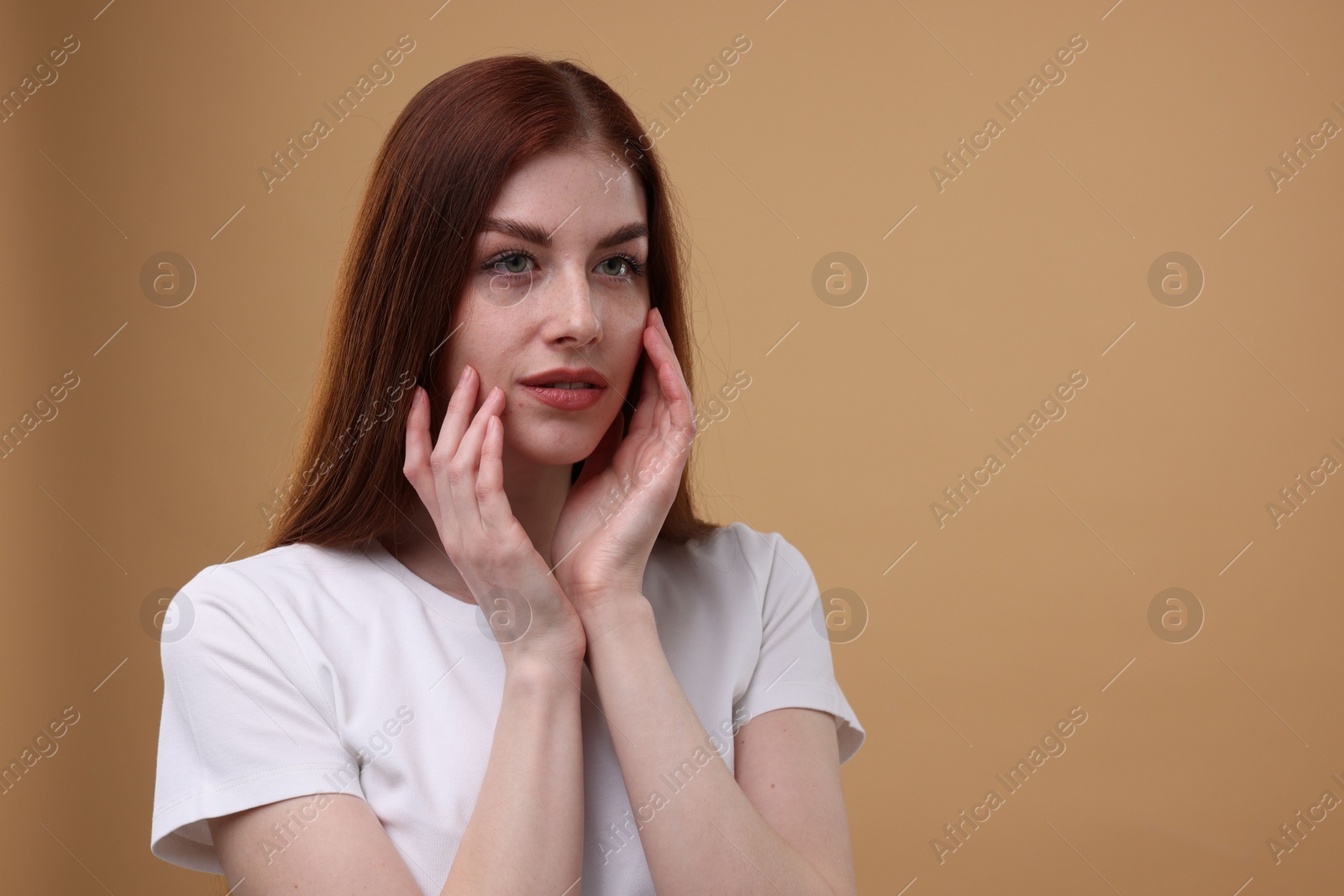 Photo of Portrait of beautiful woman on beige background. Space for text