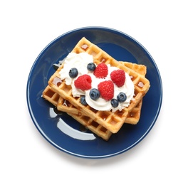 Photo of Plate with yummy waffles, whipped cream and berries on white background, top view