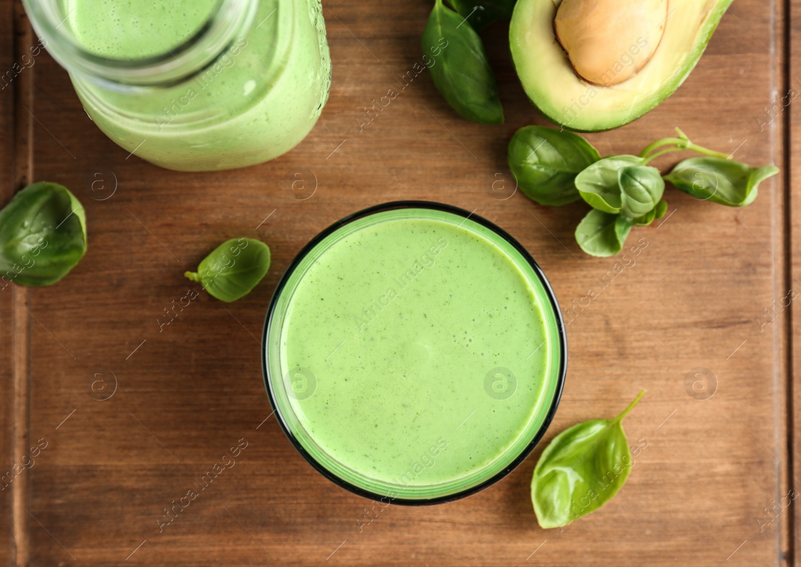 Photo of Flat lay composition with healthy detox smoothie and ingredients on wooden background