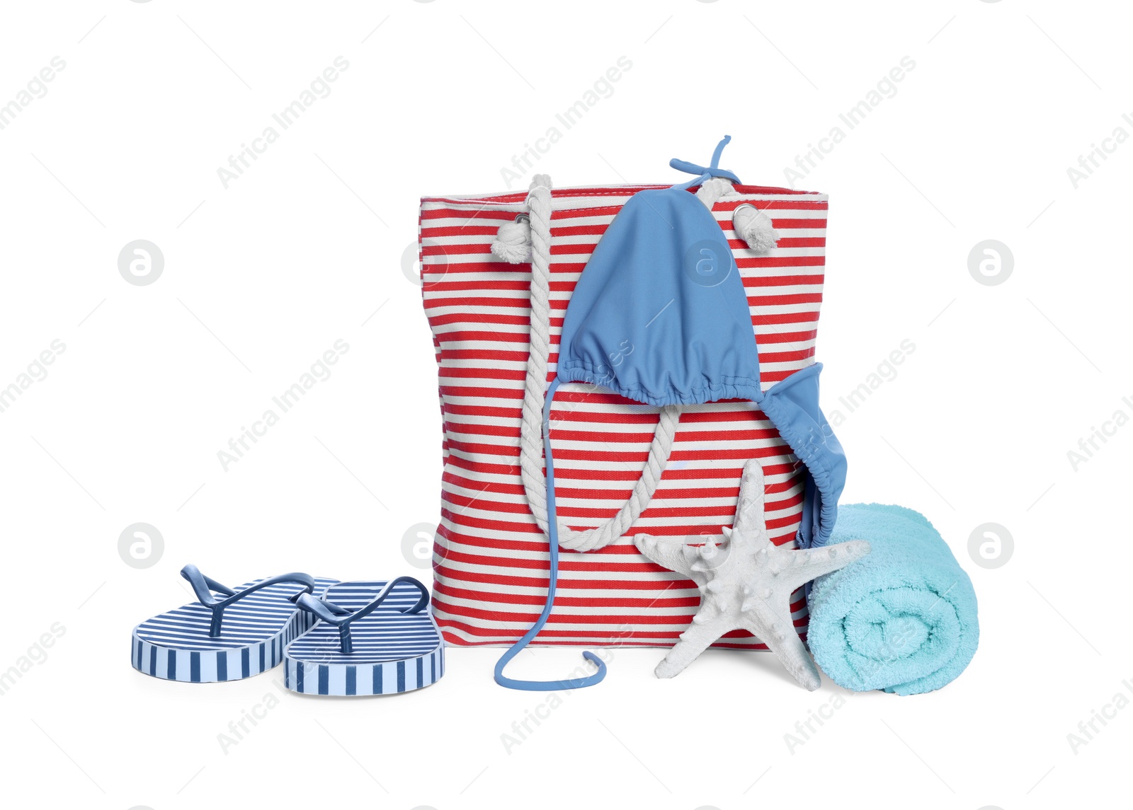 Photo of Stylish bag, starfish and other beach accessories isolated on white