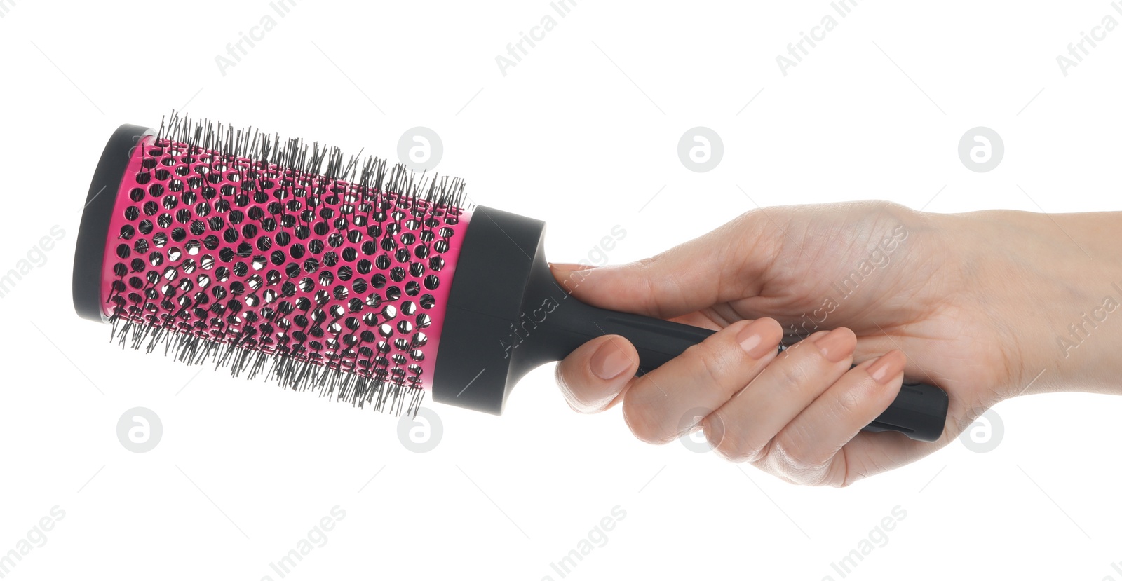 Photo of Woman holding round hair brush on white background, closeup